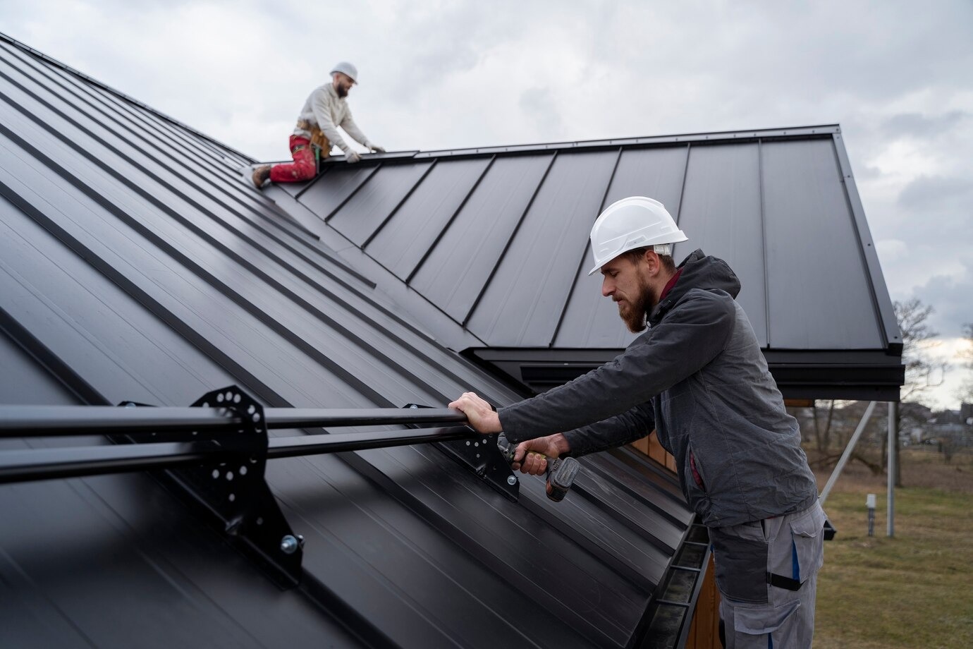 medium shot men working roof tog